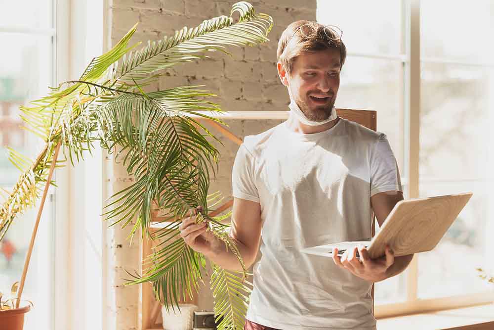 A young man studying about palms - Friendly Home